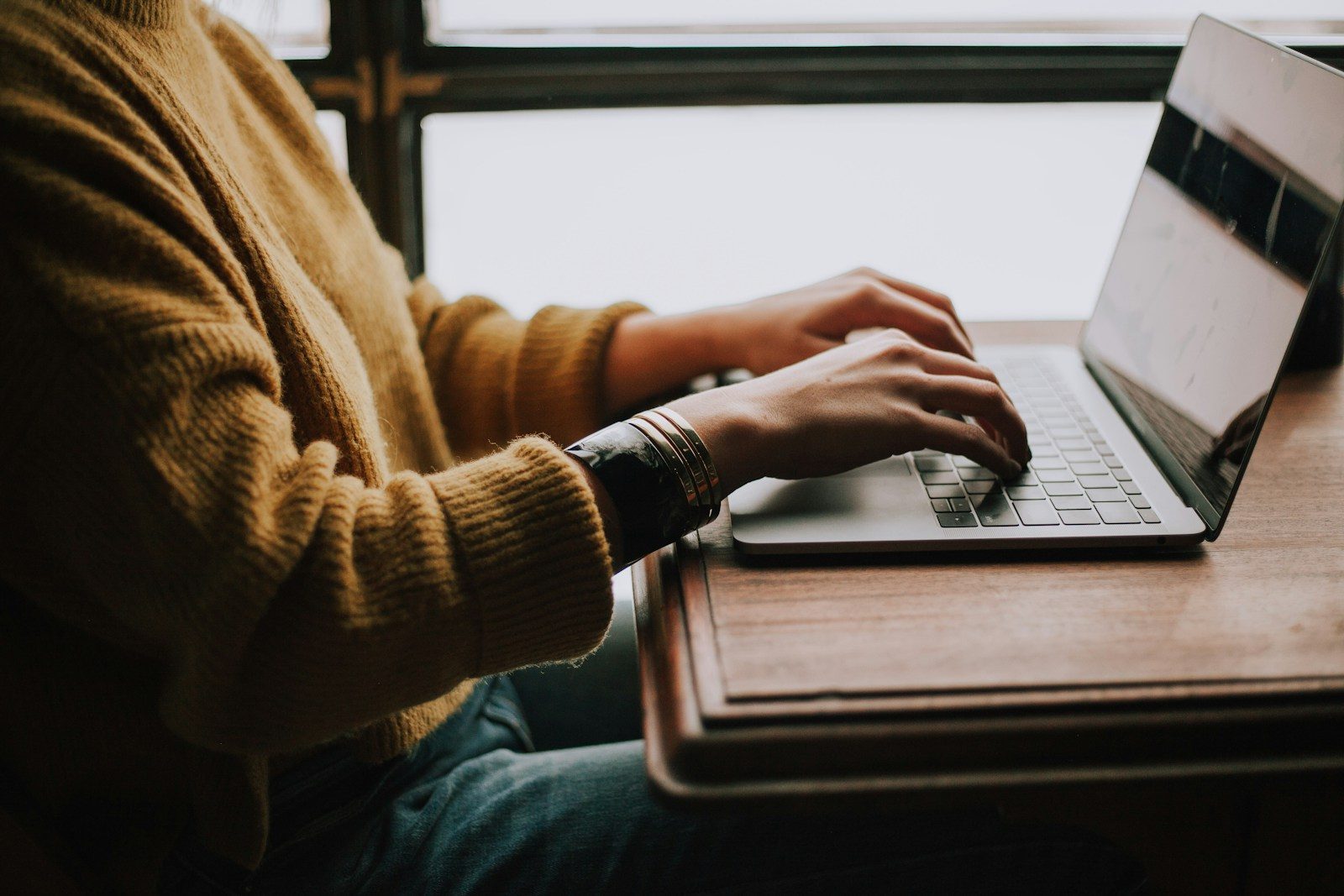 School psychologist completing online continuing education on a laptop