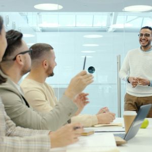 Man presenting to colleagues in a modern office setting